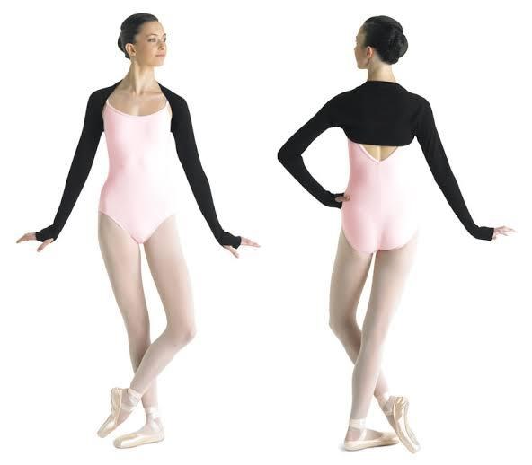 A dancer wearing pink knit warmups